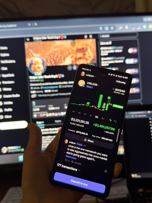 A hand holding a smartphone displaying a cryptocurrency trading interface for 'UNIPOE' showing a value of '$3,321,181.35' and a 'Deposit to buy' button, with a blurred monitor displaying Discord chats in the background.