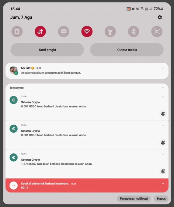 A smartphone notification panel shows three Tokocrypto alerts confirming successful deposits of USDC and SOL to the user's account, with two small USDC transfers (0.001 USDC each) and one larger 1.87165657 SOL transfer, supporting the post's observation about receiving a tiny 0.001 USDC deposit.