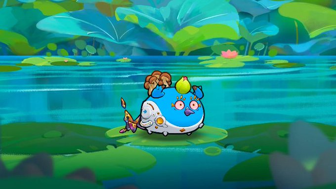 The image features a cartoon character, likely a fish or an aquatic creature, sitting on top of a lily pad surrounded by water plants. The character appears to be floating above the water with its arms outstretched. In the background, there are green leaves that add to the overall scene's atmosphere. The post congratulates Padrino for picking up this double Mystic Axie and mentions that they have been collecting axies in the last month, which translates to a total of 320 K in volume. Additionally, the post highlights that the axie has sold for 3 ETH, which is approximately 104 K.