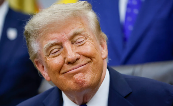 President Donald Trump smiles broadly with his eyes closed, wearing a dark navy suit and white shirt, appearing pleased as the accompanying post announces his proposed "$1.3 trillion stimulus package" featuring $5,000 direct payments to every American adult, dubbed the "Trump Dividend," tied to Republican midterm victories.