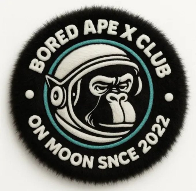 A circular black fur-textured patch featuring an astronaut ape with "BORED APE X CLUB" arched at the top and "ON MOON SNCE 2022" at the bottom, representing the BAXC logo being minted on the OOX Marketplace with raffle rewards.
