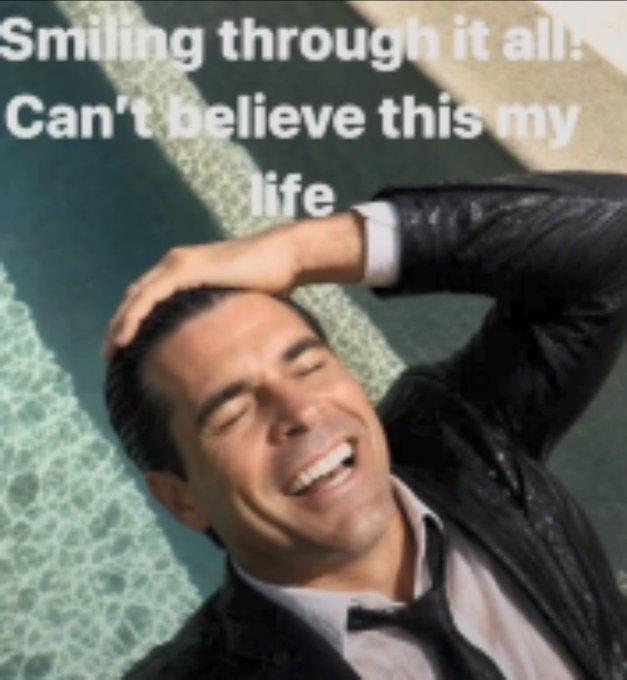 The image shows a man in a suit smiling broadly with one hand on his head, lying down by a pool, overlaid with the text "Smiling through it all! Can't believe this my life." The meme captures the euphoric, almost disbelieving joy of a $NET holder enjoying a relaxing summer day amid a market rally, perfectly matching the post's expression of blissful contentment despite—or because of—the stock's strong performance.