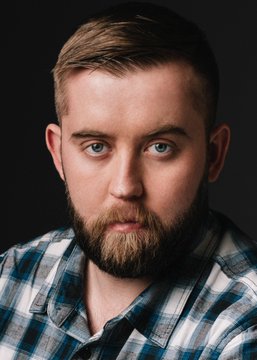 The image features a man with a beard wearing a blue and white plaid shirt, looking directly at the camera. The caption reads "BREAKING: Sergey Nazarov says security-first infrastructure is accelerating Chainlink adoption." This statement suggests that the man's perspective on the importance of security in the context of blockchain technology might be valuable or interesting to others who read the post.
