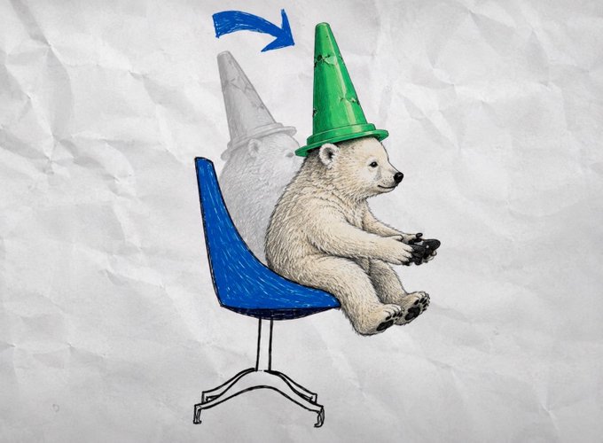 A polar bear wearing a green traffic cone hat sits casually in a blue office chair holding a game controller, with a faded ghosted version of itself behind it and an arrow pointing forward. The playful image humorously suggests the "memecoin supercycle" is accelerating forward, with the bear (often a symbol of market downturns) being playfully redirected into a bullish, party-like crypto rally.