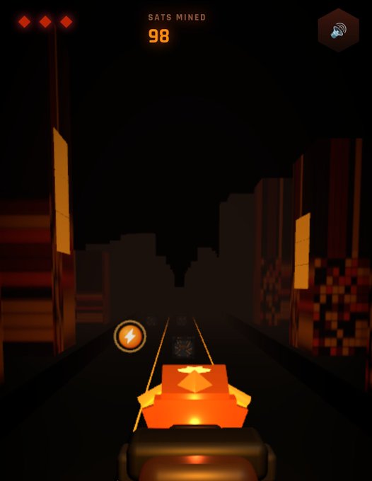 A first-person view of a mining-themed video game showing 'SATS MINED 98' at the top, with the player collecting power-ups along a dark, blocky track.