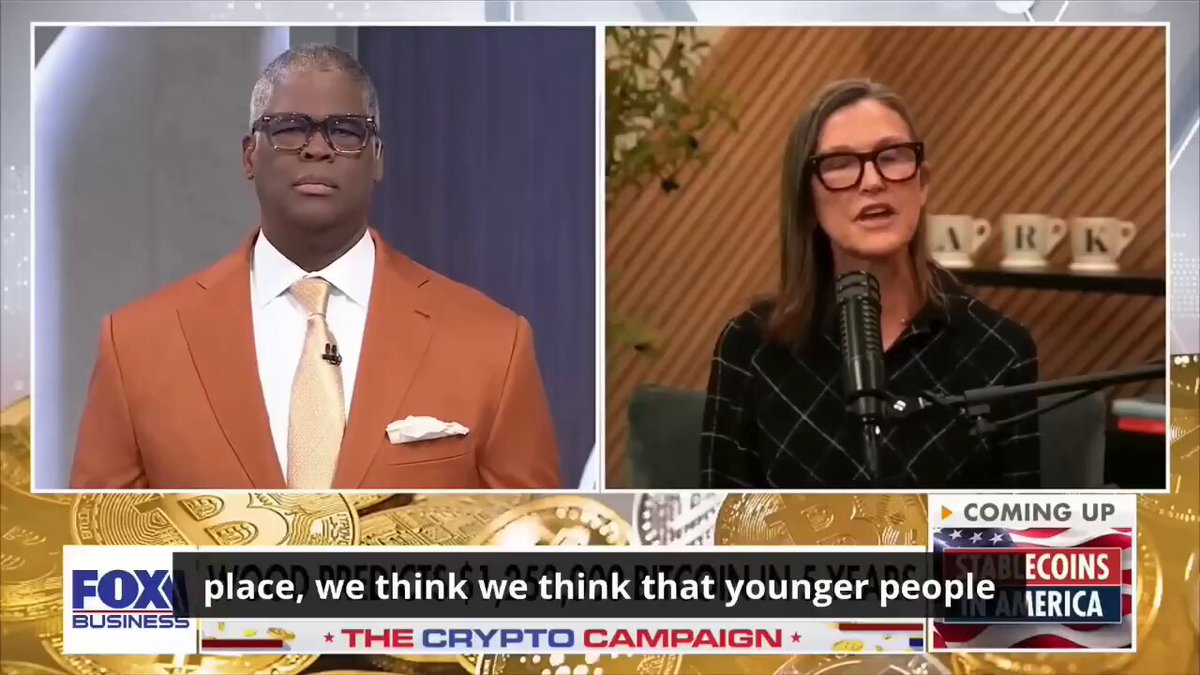 The image shows two people discussing something while wearing suits, with one of them being bald. The backdrop appears to be an evening news segment from Fox that focuses on cryptocurrency trading. They are talking about Bitcoin's potential value, with a prominent quote attributed to Cathie Wood, the CEO ofARK Invest, who says "our bull case for Bitcoin is $1.25 million. Our base case is $750,000". The text emphasizes that Wall Street is shifting its focus from asking if Bitcoin can survive to positioning for a future where it could be worth millions or even billions of dollars.