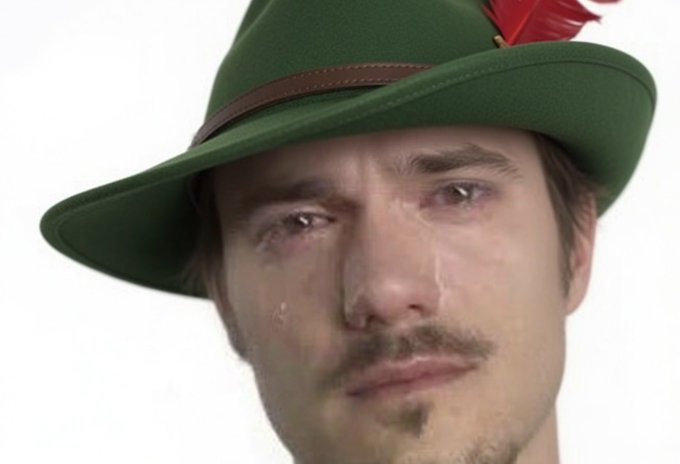 A man wearing a green hat with a red feather and tears in his eyes looks pleadingly at the camera. The image humorously embodies the desperate, emotional plea in the caption, which begs someone named "Vlad" to share a single tweet about a cat in exchange for bridging out and never returning—a plea so heartfelt it captures the "fighting demons" sentiment of the community.
