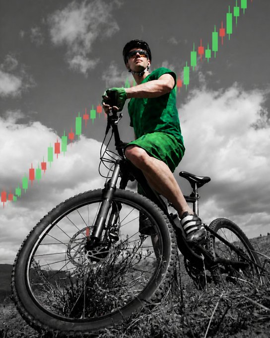 A cyclist pauses mid-ride on a steep mountain slope, with a sharply rising green and red candlestick chart overlaid against the cloudy sky—visually echoing the post's witty comparison between the climbing market trend and the Krvavec gradient.