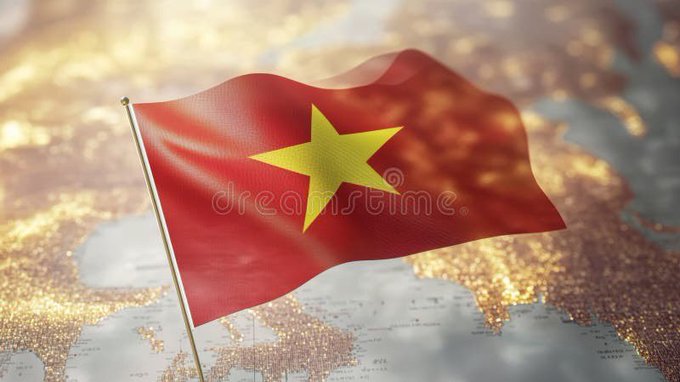 The image shows a small Vietnam flag (red with a yellow star) waving on a golden flagpole, placed over a softly blurred world map background with warm, glowing lights. The Vietnamese flag symbolizes the poster's location and national identity, while the world map in the background reflects their message about connecting with friends ("ae") globally across all countries.