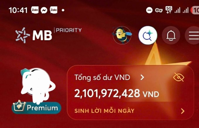 A screenshot of the MB Priority mobile banking app showing a total balance of 2,101,972,428 VND, with a 'Premium' status indicator featuring a white character mascot.