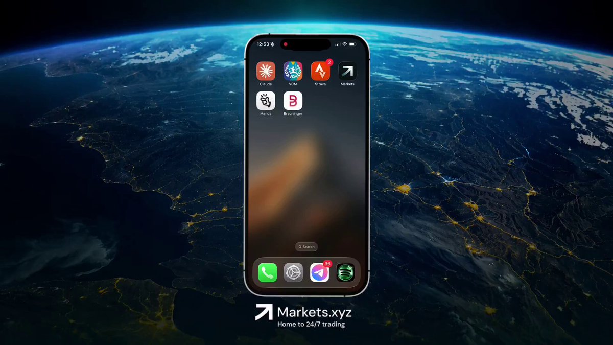 The image shows a cell phone with an app icon displayed on its screen. The app appears to be related to the markets.xyz launch, possibly offering information about the economy or financial news. The background of the image features a planet Earth, suggesting that the app is designed for mobile devices and can be accessed from anywhere in the world.