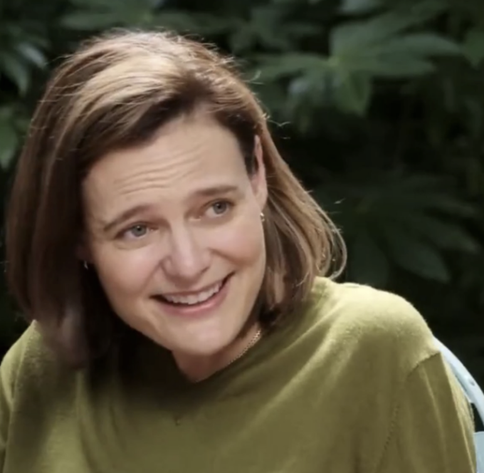 "Your Don't Really Think That Bitcoin Will Break $60k Right?" The image features an interview with a woman wearing a green shirt. She is smiling and looking towards the camera, conveying a positive and approachable demeanor. In her left hand, she holds a cell phone. On the right side of the photo, there's text that reads "Do you want to set the record straight?". This suggests that someone might have questioned or disputed the information presented in the image, possibly about Bitcoin transactions or other relevant topics.