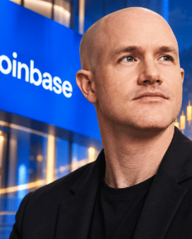 Brian Armstrong, CEO of Coinbase, is shown in front of a blue backdrop featuring the Coinbase logo, accompanying news of Coinbase's partnership with Moov to integrate stablecoin acceptance into over 1,000 U.S. community banks and credit unions.