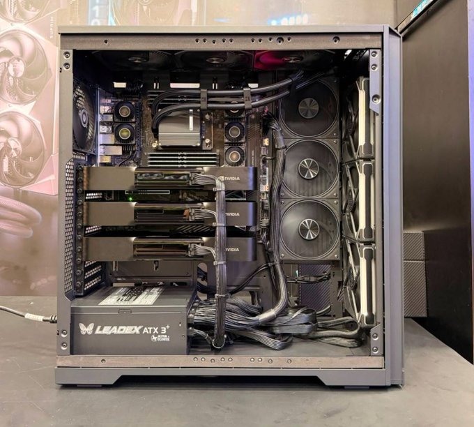 Interior view of a high-end custom PC build featuring multiple NVIDIA GPUs, a liquid cooling system, and a Leadex ATX 3+ power supply unit.
