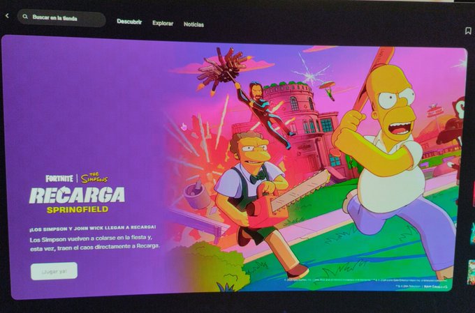 A computer screen displaying a promotional banner for "FORTNITE x The Simpsons" with Spanish text "RECARGA SPRINGFIELD" and artwork of Homer Simpson wielding a chainsaw.