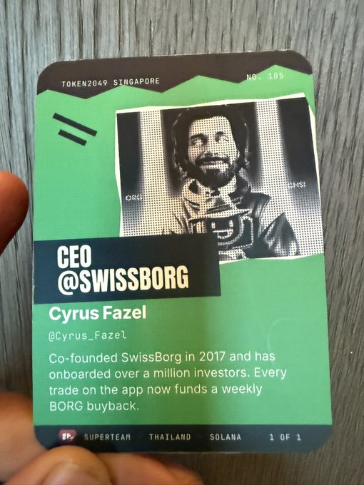 A green trading card labeled 'TOKEN2049 STNGAPORE', 'NO. 185', and 'CEO @SWISSBORG' features a halftone photo of Cyrus Fazel (@cyrus_Fazel) with text describing him as co-founder of SwissBorg in 2017; bottom text reads 'IP, SUPERTEAM, THAILAND, SOLANA, 1 OF 1'.