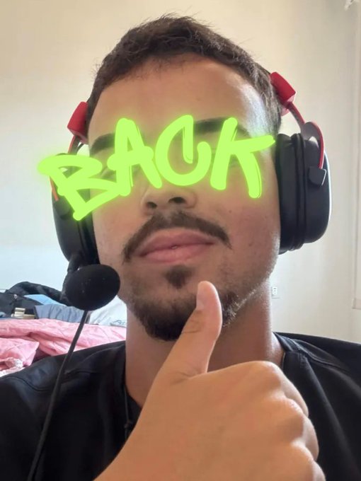 A man wearing a red and black headset gives a thumbs-up, with the word 'BACK' overlaid in bright green graffiti-style text.