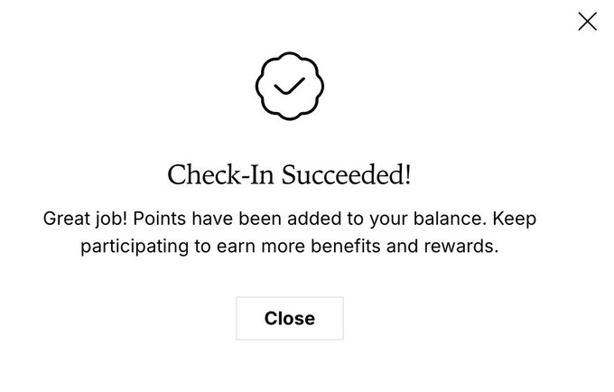 A black and white check-in success message with a clock graphic, congratulating the user on their achievement.