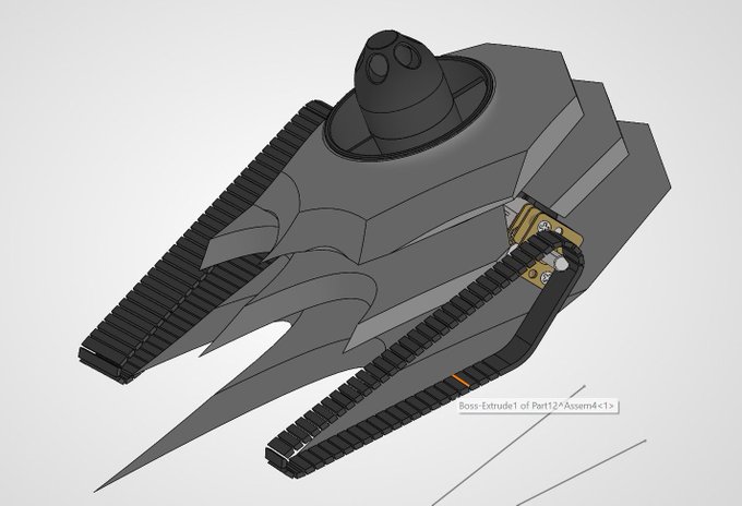 A 3D CAD rendering of a gray tank-like vehicle with tracks on both sides and a pointed front, labeled 'Boss-Extrude1 of Part12<Assem4<1>'.