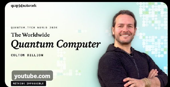 A promotional graphic for a YouTube video titled 'The Worldwide Quantum Computer' by Colton Dillion, featuring a smiling man on a light blue pixelated background with text 'Quantum.Tech World 2026' and 'RETHINK IMPOSSIBLE'.