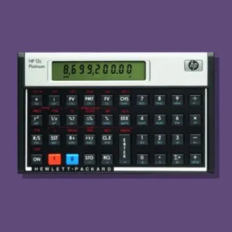 A vintage Hewlett-Packard HP 12c Platinum calculator displaying the value 8,699,200.00 on its LCD screen against a purple background.