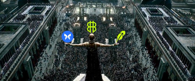 A hooded figure stands before a massive crowd, arms outstretched, with the XRP, Morpho, and Bitcoin logos balanced on each hand—symbolizing the post's message of letting critics speculate while championing a $TIBBIR and Morpho partnership. The grand, cinematic scene evokes spectacle and confidence in the face of doubt.
