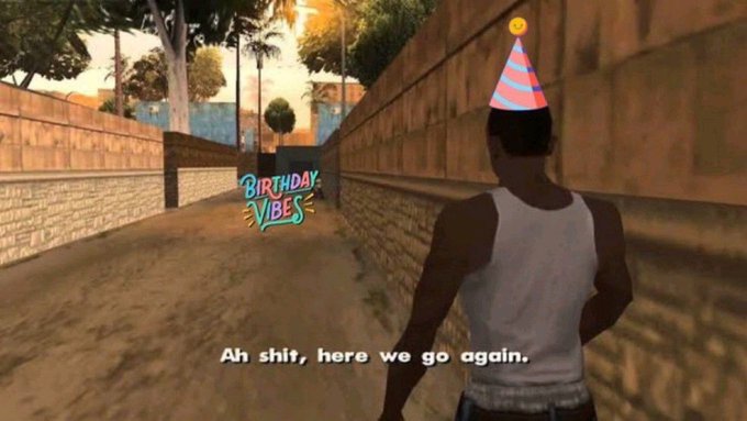 A screenshot from Grand Theft Auto: San Andreas showing the character CJ wearing a striped party hat in an alleyway, with a 'BIRTHDAY VIBES' graphic and subtitle text 'Ah shit, here we go again.'
