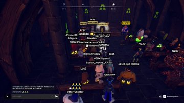A dark, crowded multiplayer video game scene showing numerous player characters with usernames floating above them in what appears to be a cave or dungeon environment.