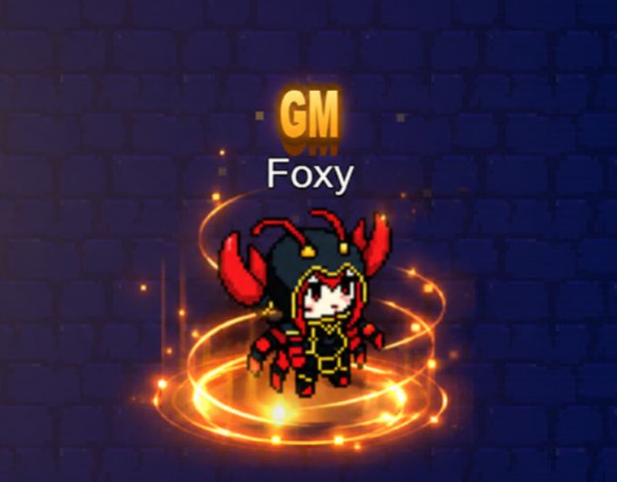 A pixel art character named 'Foxy' with a 'GM' label, surrounded by glowing orange rings against a dark blue brick wall.