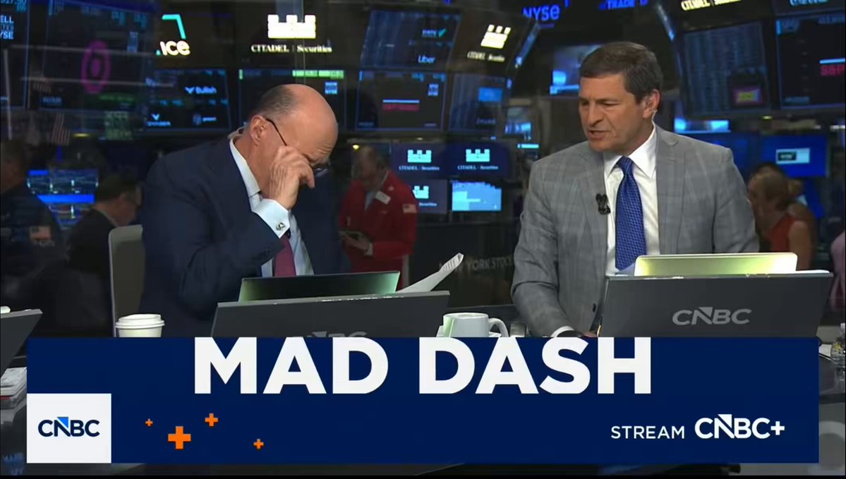 The image shows a news broadcast with two men sitting behind their desks, one of whom appears to be a financial reporter named Jim Cramer. They are both wearing suits and ties, suggesting that they are professionals in their field. The background features multiple screens displaying stock market information, indicating that the news is related to finance or the stock market.

The post also includes text about a man touching something, which could possibly be an object or a situation relevant to the financial industry. The image focuses on Jim Cramer and his colleagues at CNN, providing viewers with insights into their work and expertise in the field of finance.