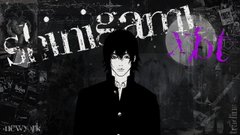 The image features a man with spiky hair wearing a black suit standing against a dark background. The text "Strinigami Xt" is written above him, indicating that he is from the game Strinigami Xt. The surrounding area appears to be a room filled with various posters and signs, suggesting an environment related to gaming or streaming.