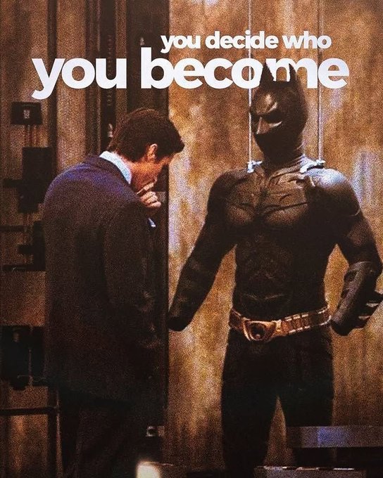 A meme showing Bruce Wayne looking down in his suit while Batman stands beside him in the Batcave, with the text 'you decide who you become' overlaid at the top.