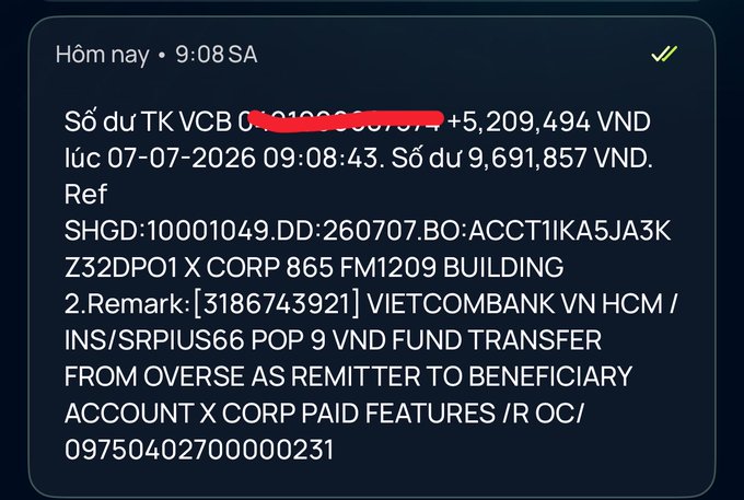 Vietcombank (VCB) mobile banking SMS notification dated 07-07-2026 showing a +5,209,494 VND credit (balance 9,691,857 VND) from a VIETCOMBANK VN HCM overseas fund transfer to X CORP.