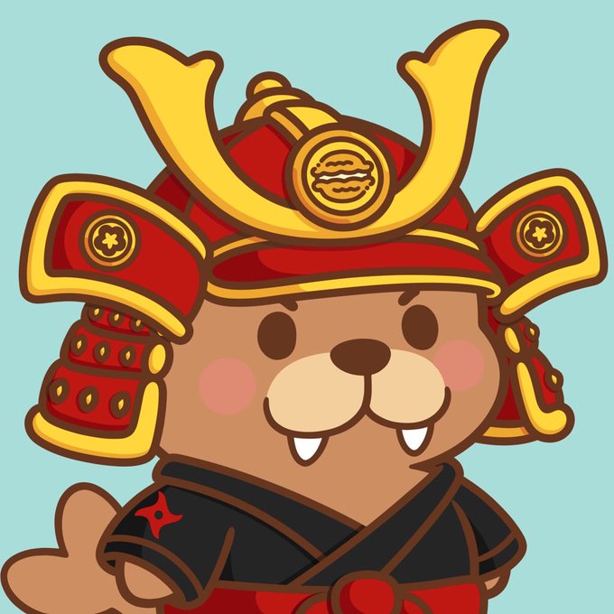 A cartoon illustration of a cute brown bear character dressed in red and gold samurai armor with a traditional Japanese kabuto helmet against a light blue background.