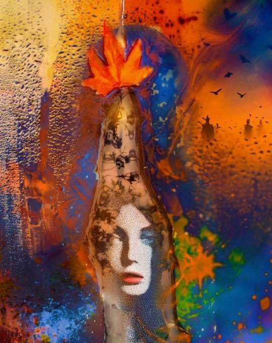 An artistic, colorful image featuring a woman's face blended with autumn leaves and abstract paint splatters in orange and blue tones.