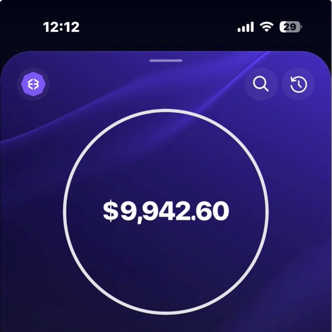Mobile wallet screen displaying a balance of $9,942.60 with a dark purple gradient background.