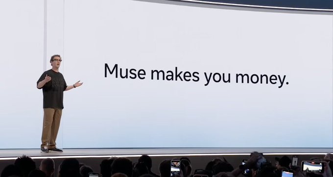 A man stands on a stage presenting to an audience, with a large screen behind him displaying the text 'Muse makes you money.'