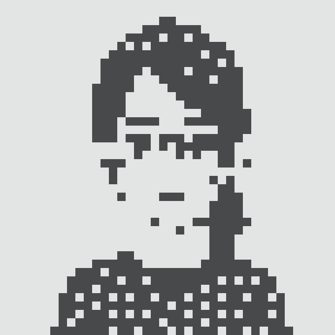 A pixel art skull design in dark navy/black on a white background, featuring a stylized human skull with hollow eye sockets and visible teeth/jaw structure.