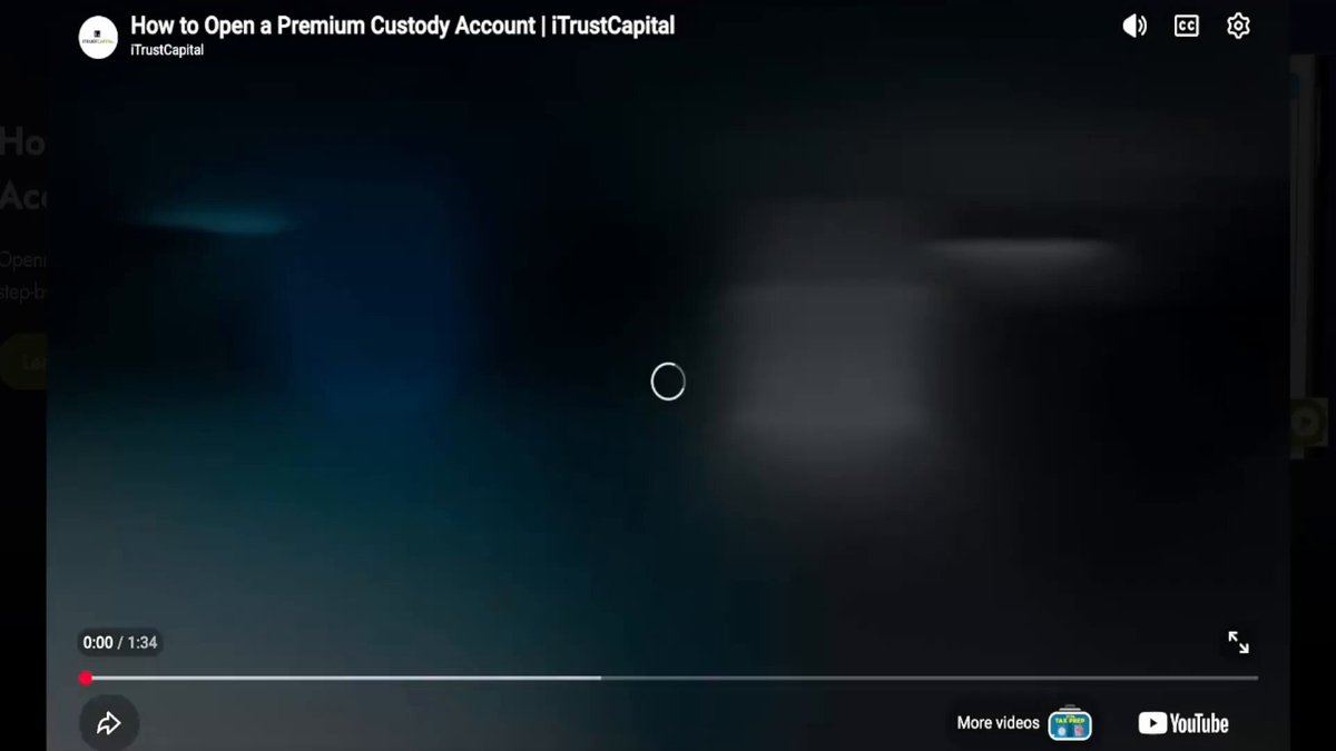 The image shows a computer screen displaying a video or webpage with information about premium custody accounts. The content seems to be related to crypto account security, as there's a warning about potential hackers targeting crypto accounts. Premium Custody Accounts are being discussed as a solution for protecting one's assets in the crypto world, and they have no annual contribution limits compared to cryptocurrency IRAs.

The image also contains some text that reads "@iTrustCapital built Premium Custody Accounts (PCAs). Unlike Crypto IRAs, Premium Custody Accounts have no annual contribution limits and transactions are taxable". This information might be useful for viewers who want to learn more about how premium custody accounts can help secure their crypto assets.