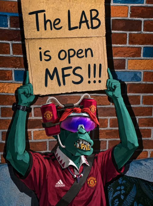 An AI-generated or digitally edited artwork of a green-skinned character wearing Manchester United gear, sunglasses, and a face covering, holding up a cardboard sign that reads 'The LAB is open MFS!!!'.