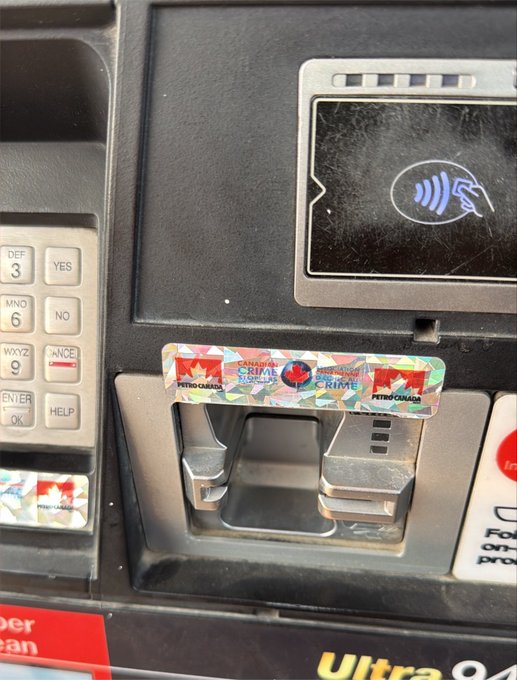 Close-up photo of a gas pump keypad and card reader, with a Petro-Canada 'Earn More Rewards' sticker visible above the card slot.