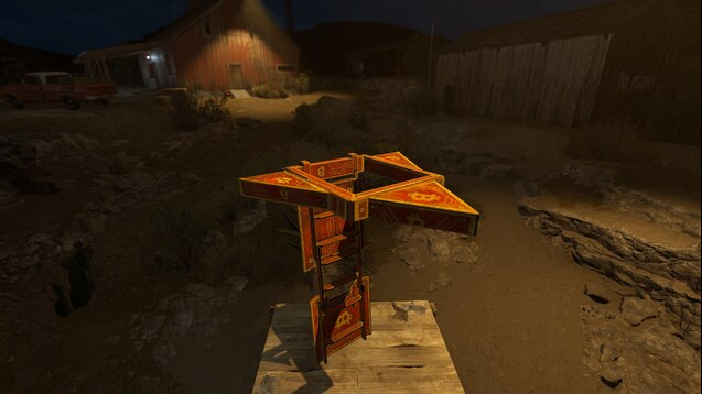 A first-person view in a video game showing a wooden crate with orange warning symbols placed on a platform in a dark, desert-like environment.