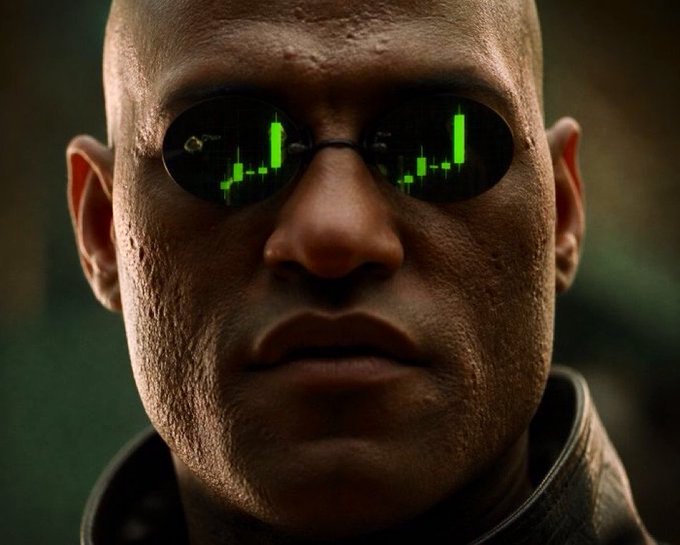 A close-up of Morpheus from The Matrix wearing his signature sunglasses, which reflect the green cascading digital code.