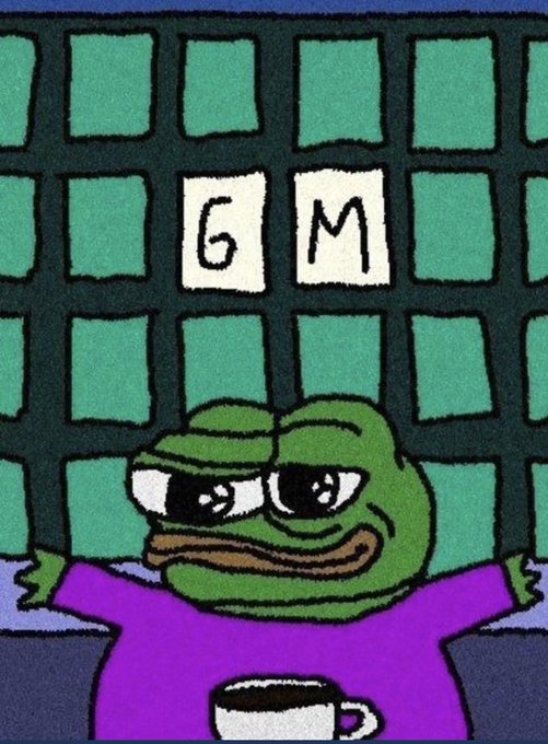 A cartoon image of a green frog wearing a purple shirt, smiling with a coffee mug in front of it, standing against a green tiled background with the letters 'GM' displayed on tiles.
