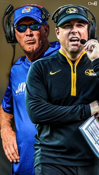 Two college football coaches wearing headsets—one in a blue Kansas cap and shirt, the other in a gold-trimmed Missouri pullover—appear animated on the sidelines, representing the rivalry matchup between the two schools as Missouri is favored over Kansas in their upcoming Border War game.