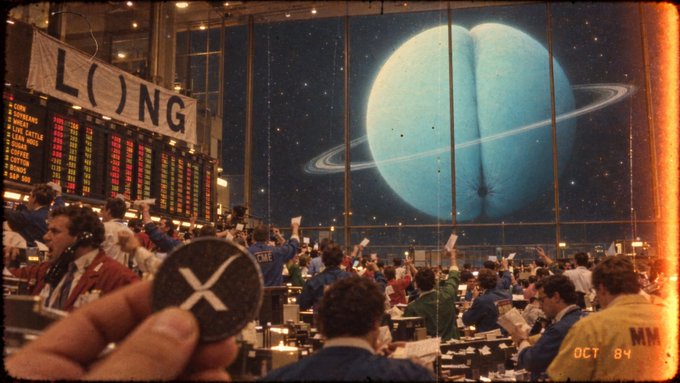 A stylized, retro-styled image showing a busy trading floor overlaid with a large view of a ringed planet in space, a banner reading 'LONG', and a hand holding an XRP cryptocurrency coin in the foreground, dated 'OCT 84'.