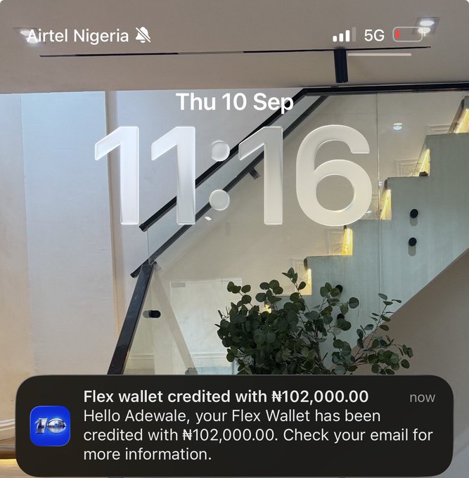 An iPhone lockscreen showing the time 11:16 on Thursday, September 10, with a notification from "10" stating "Flex wallet credited with ₦102,000.00" to user Adewale, reinforcing the post's message about saving half and using the other half.