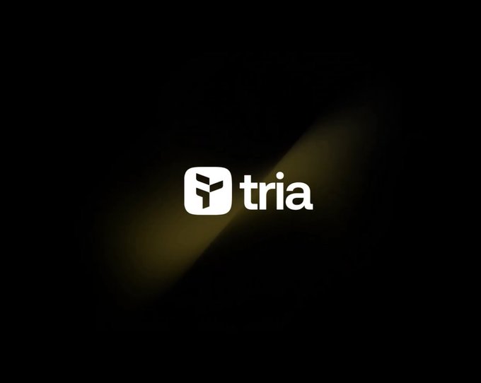 The image features a black background with white text that reads "tria" at the top, followed by the word "useTria" below it. This suggests that the image might be related to cryptocurrency or digital currency, as the name "tria" is commonly used for wallet addresses in the crypto world. The post also mentions that MindoAI can be used with a crypto wallet to make spending more convenient and secure.