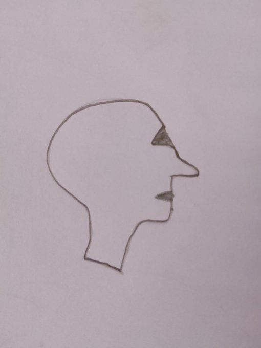 A minimalist line drawing in profile of a human head and face on white paper.