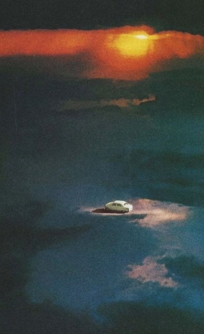 A solitary car sits on a glowing platform amidst a vast, dark expanse under a fiery sunset, evoking a sense of surreal isolation that complements the ethereal, otherworldly mood of the "Redbone" digital collage listing at .25 ETH.